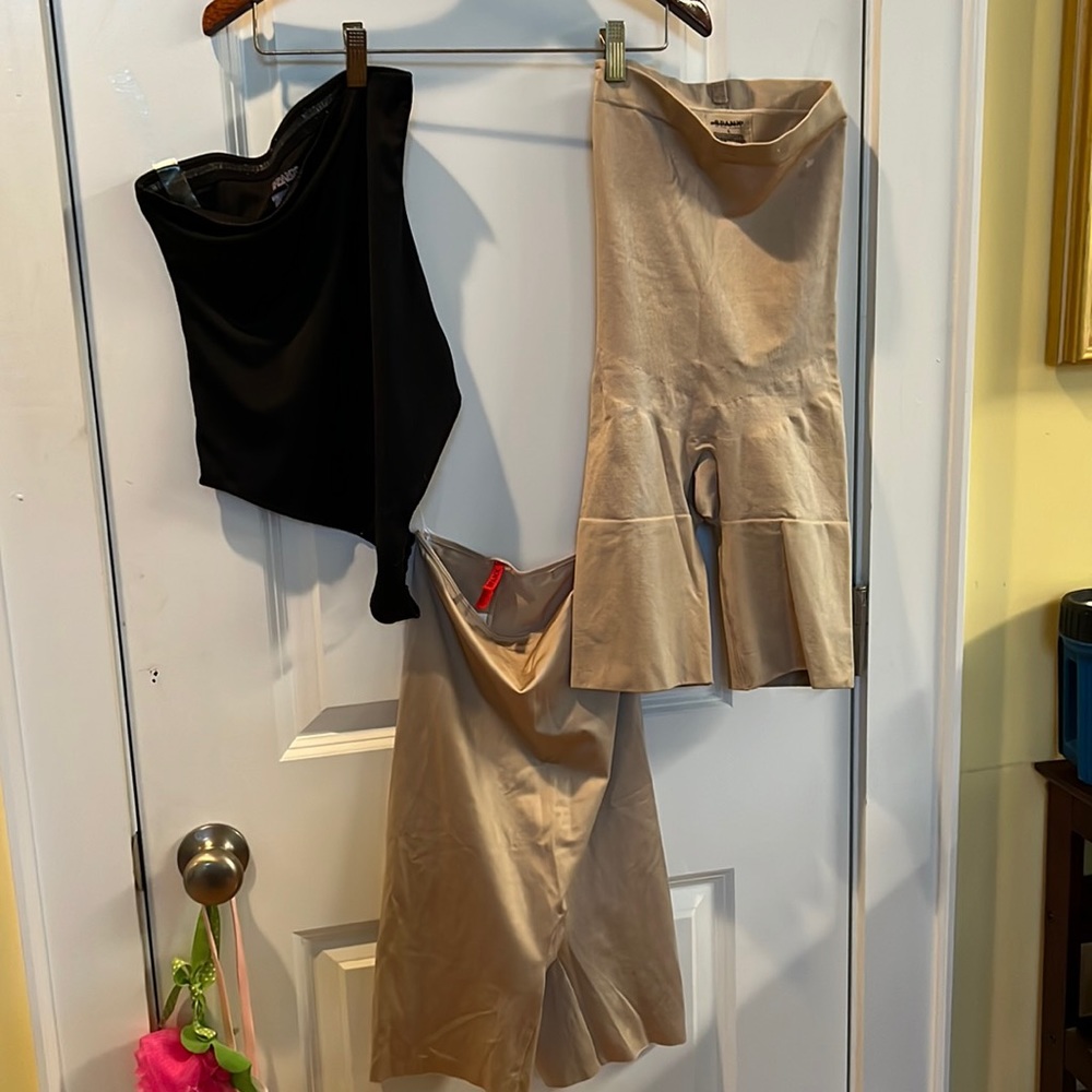 Three different styles of Spanx slimmer. Size large